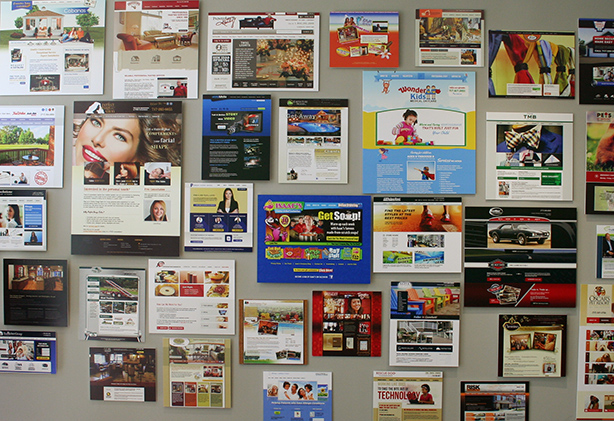 EZMarketing web design examples on wall