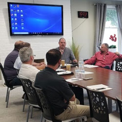EZMarketing Team discussing marketing