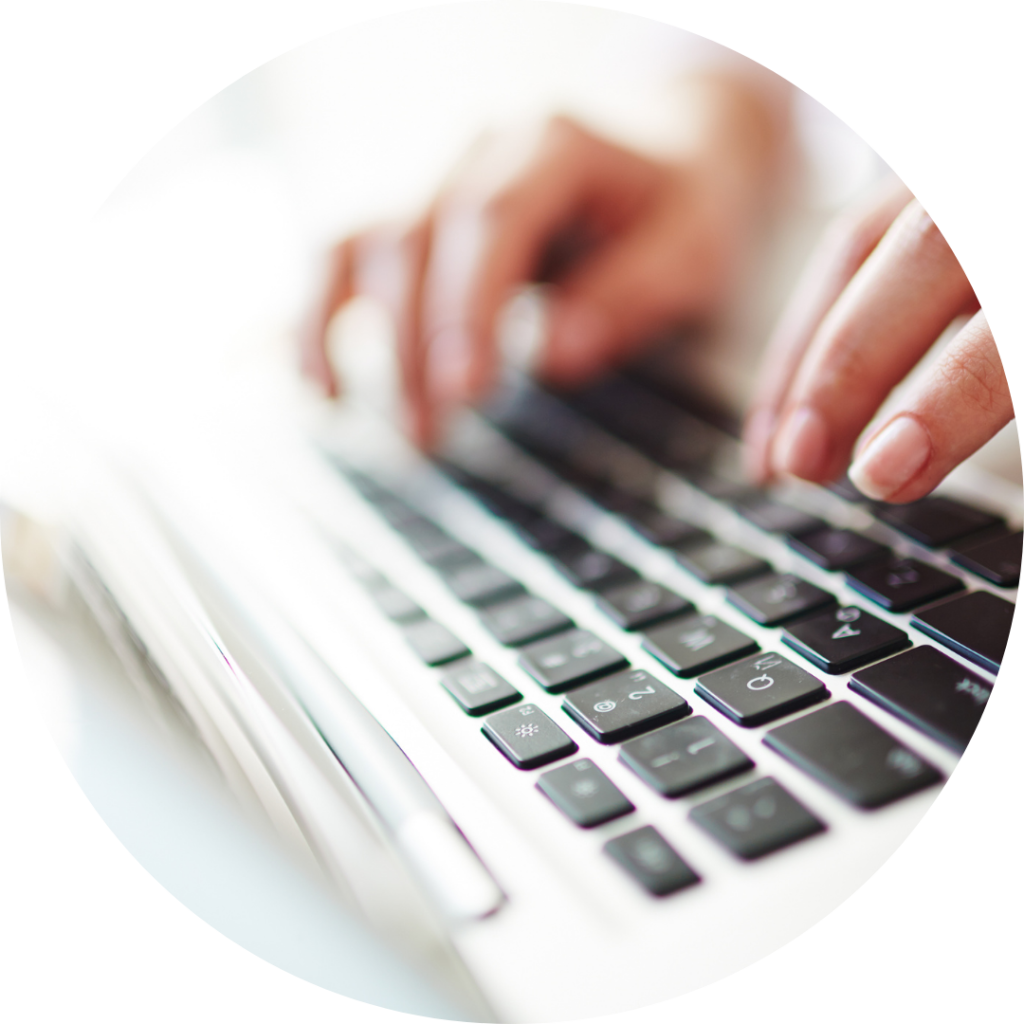 hands typing on keyboard