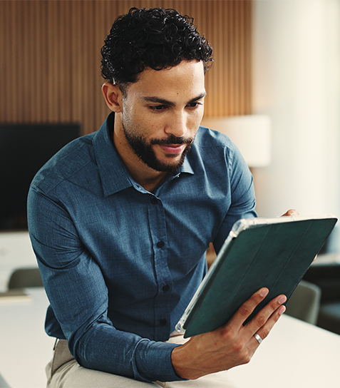 Typing, tablet and business man in office for finance review, investment and trading analyst